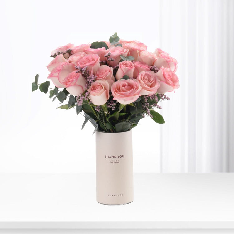 Soft pink roses in minimalist white vase with "Thank You" text.