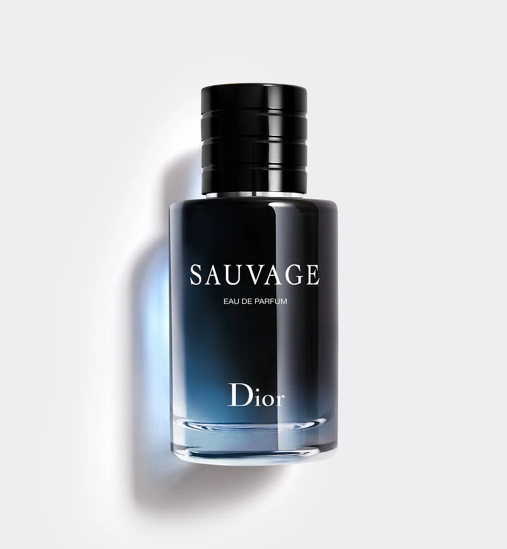 Dior Sauvage Eau de Parfum: sleek black bottle, gradient blue liquid, bold white lettering, minimalist luxury design.