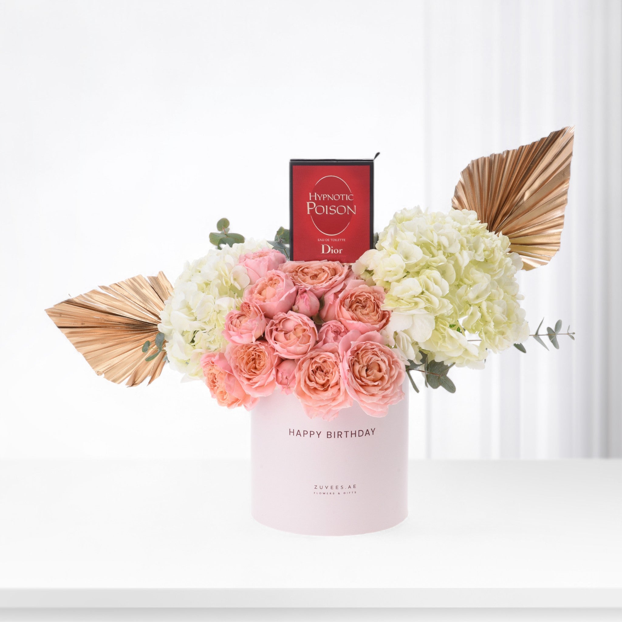 Pink roses and hydrangeas with gold fans, Dior perfume, in "Happy Birthday" vase.