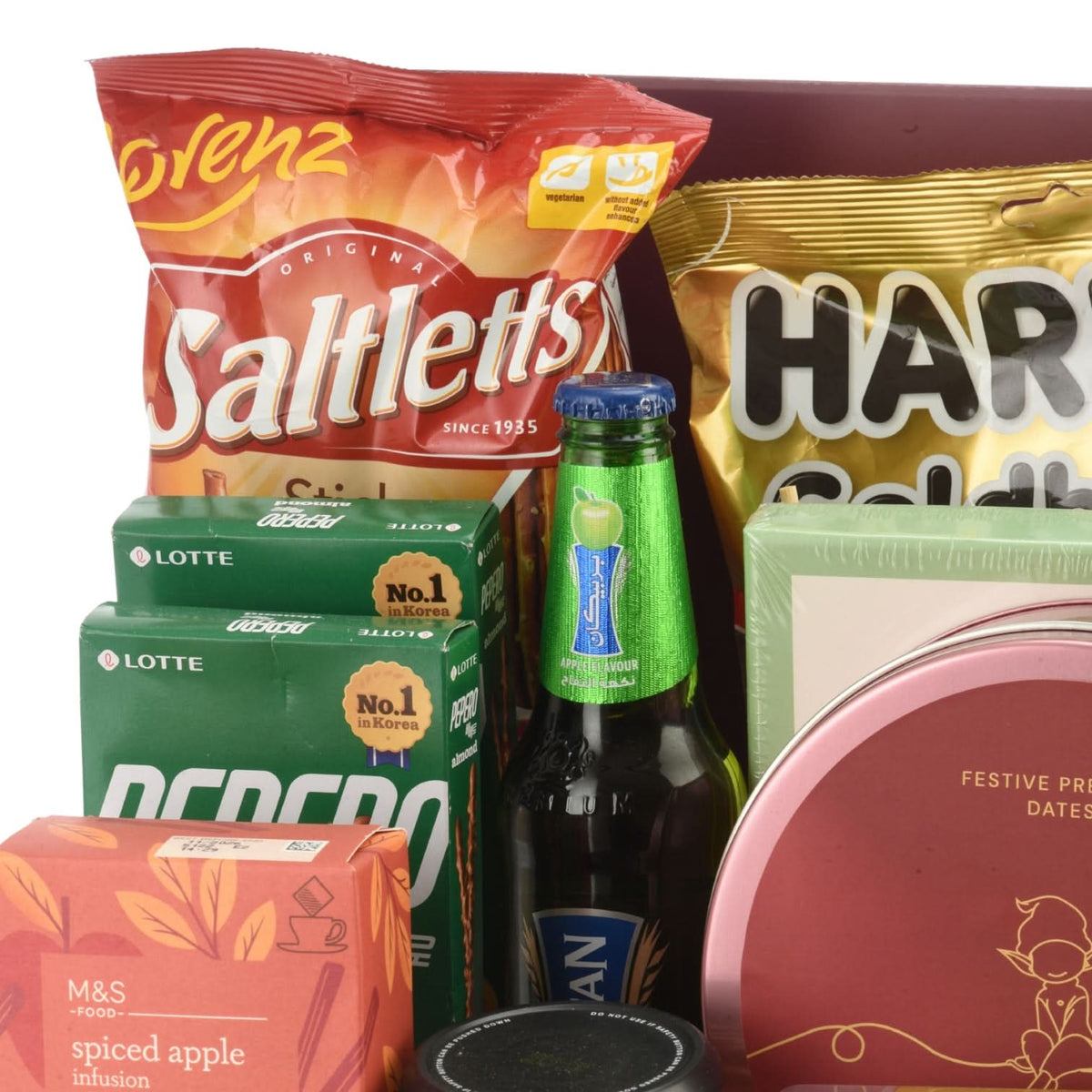 Vibrant snack and drink assortment featuring bold red, green, and gold packaging.