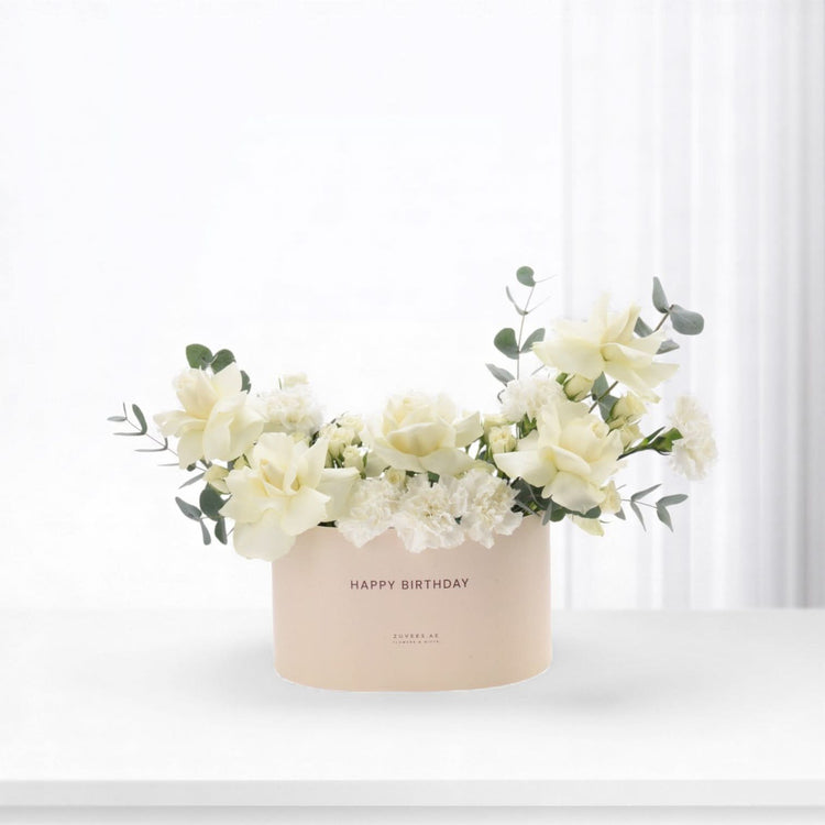 Elegant white roses, carnations, eucalyptus in blush "Happy Birthday" box, minimalist chic.