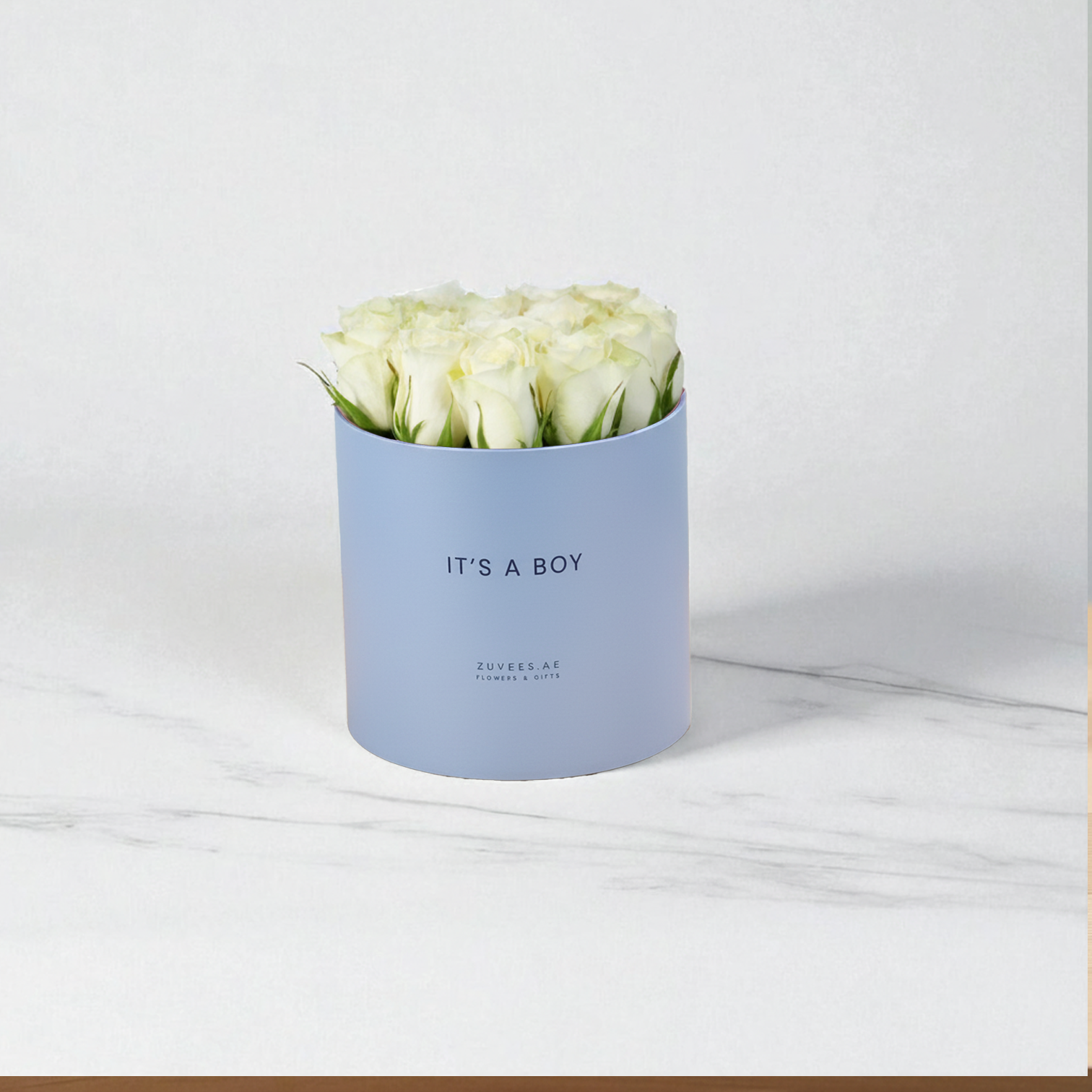 Soft blue box holds creamy white roses, "IT&