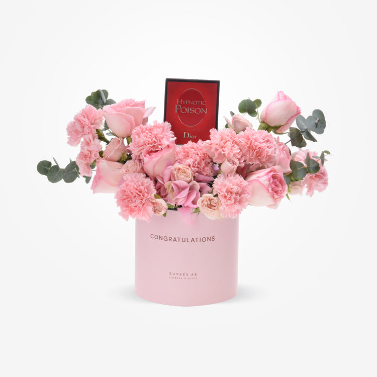 Pink floral arrangement with Dior perfume, in "Congratulations" box.