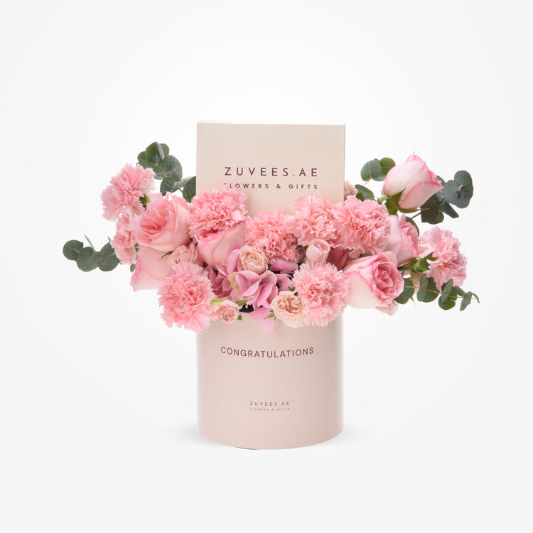 Soft pink roses and carnations in elegant "Congratulations" cylinder gift box.