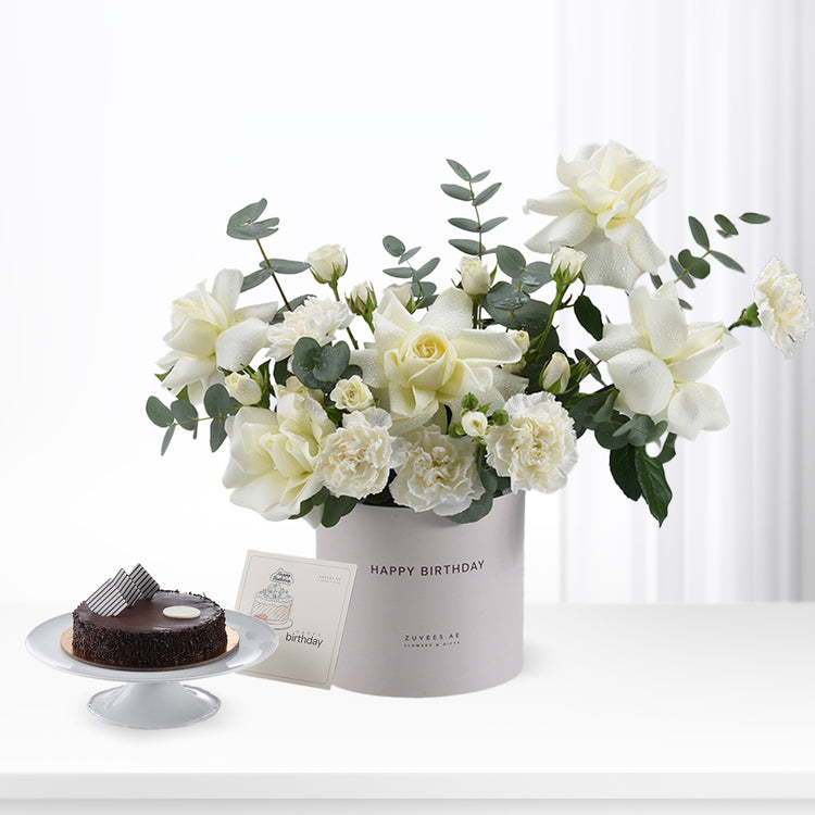 Elegant white roses and eucalyptus in gray "Happy Birthday" box with chocolate cake.