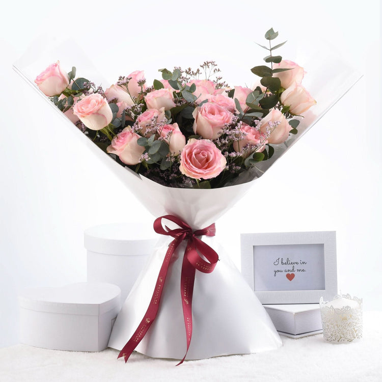 Soft pink roses, eucalyptus, and baby&