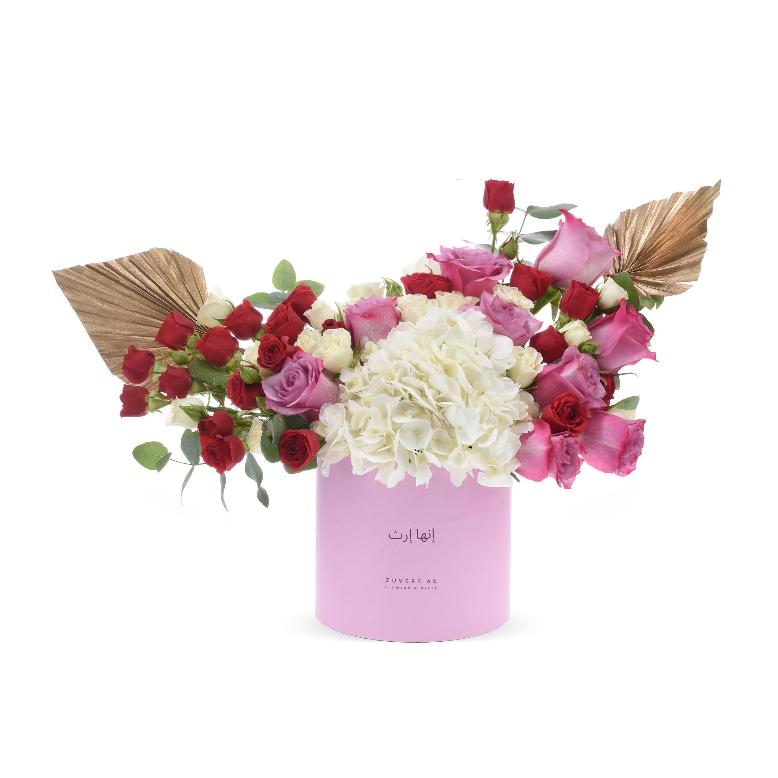 Pink box with red, pink, white roses, hydrangeas, gold leaves, elegant floral gift arrangement.
