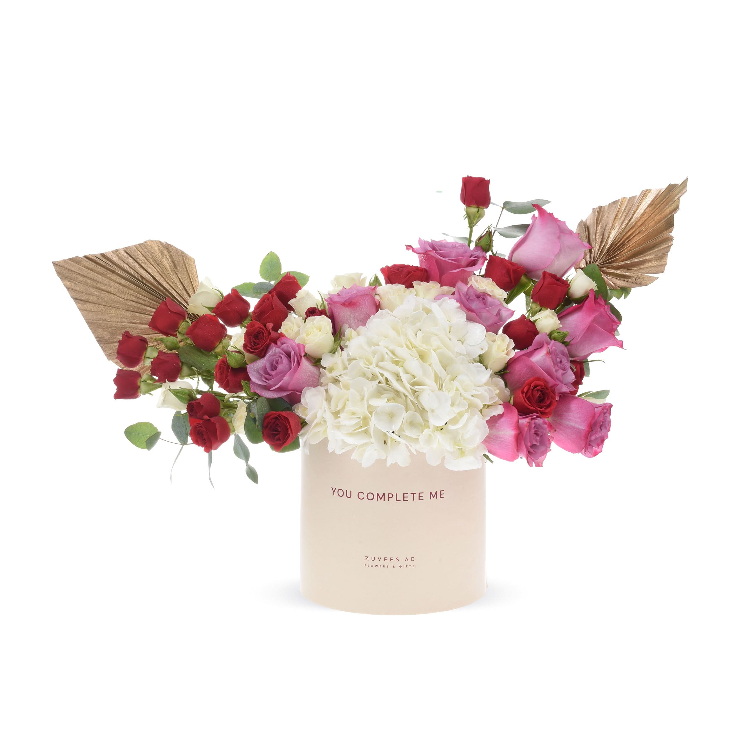Elegant floral arrangement in cream box with "You Complete Me" text.