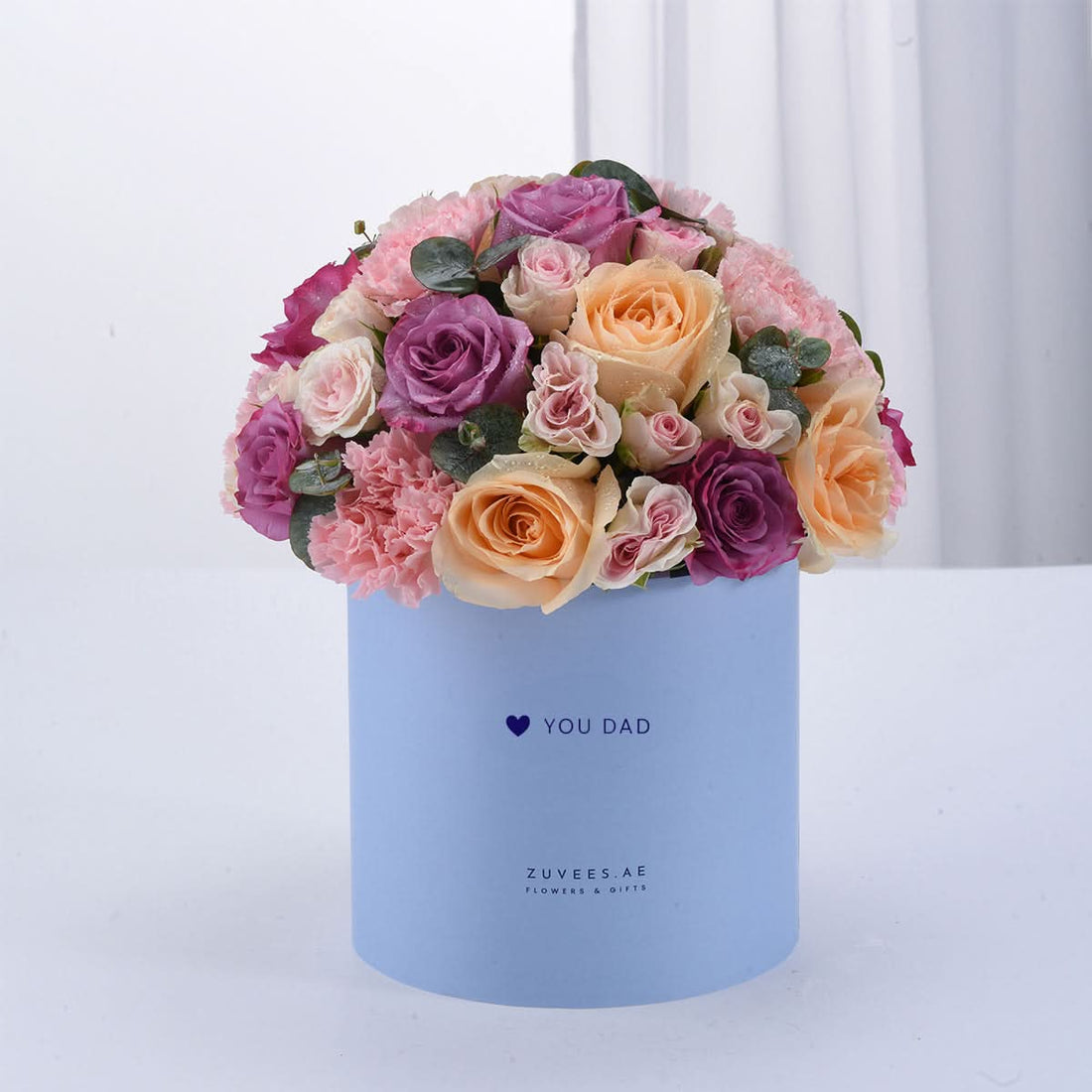 Pastel pink, purple, and peach roses in light blue box with "YOU DAD" message.