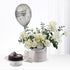 Silver balloon, white roses, chocolate cake—elegant birthday gift set.
