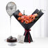 Orange roses in black wrap, chocolate cake, silver birthday balloon.