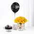 Black balloon, yellow roses, chocolate cake—birthday celebration bundle.