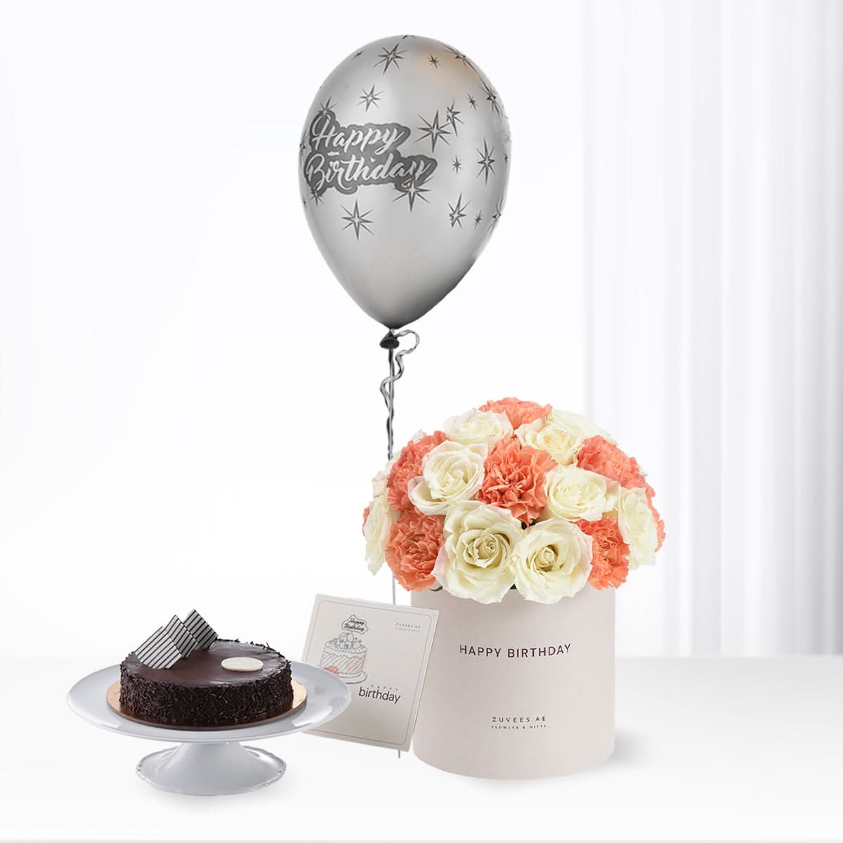 Silver balloon, coral-white roses, chocolate cake—perfect birthday gift set.