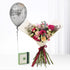 Silver "Happy Birthday" balloon floats beside vibrant rose bouquet with burgundy ribbon and green gift box.