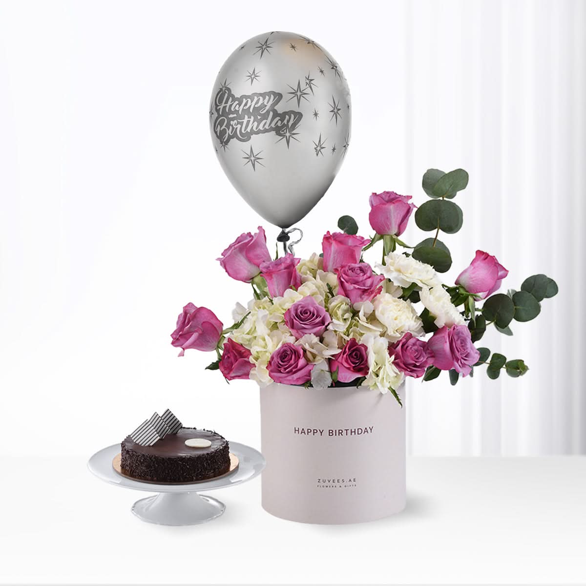 Silver balloon, pink roses, white hydrangeas, chocolate cake, "Happy Birthday" gift set.