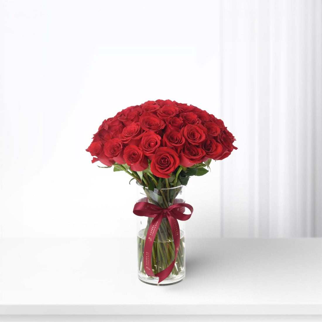 51 Red Roses In Glass Vase - Zuvees.ae
