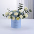 Soft blue box holds creamy roses, hydrangeas, and eucalyptus—perfect Father’s Day gift.