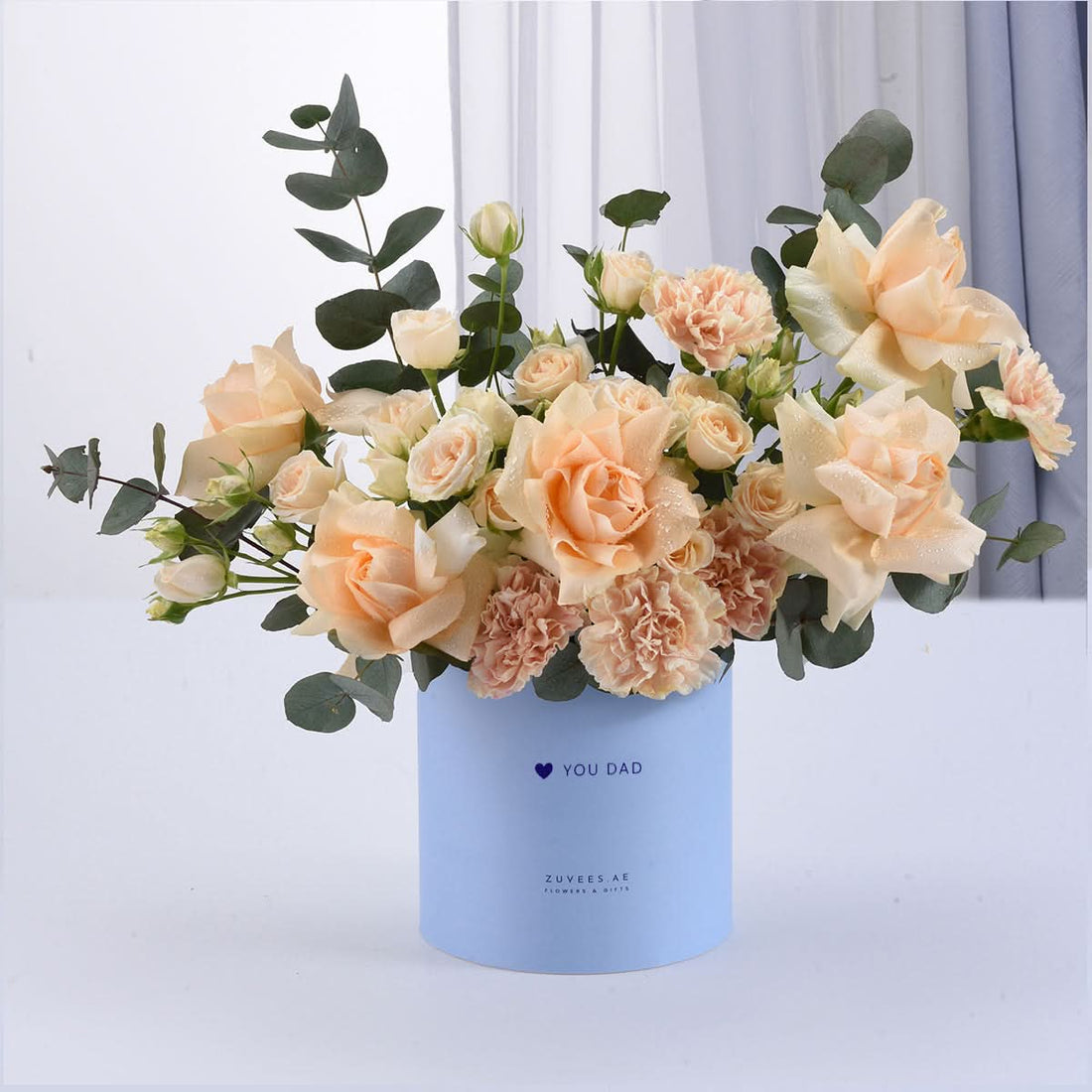 Soft peach roses and carnations in light blue “YOU DAD” gift box.