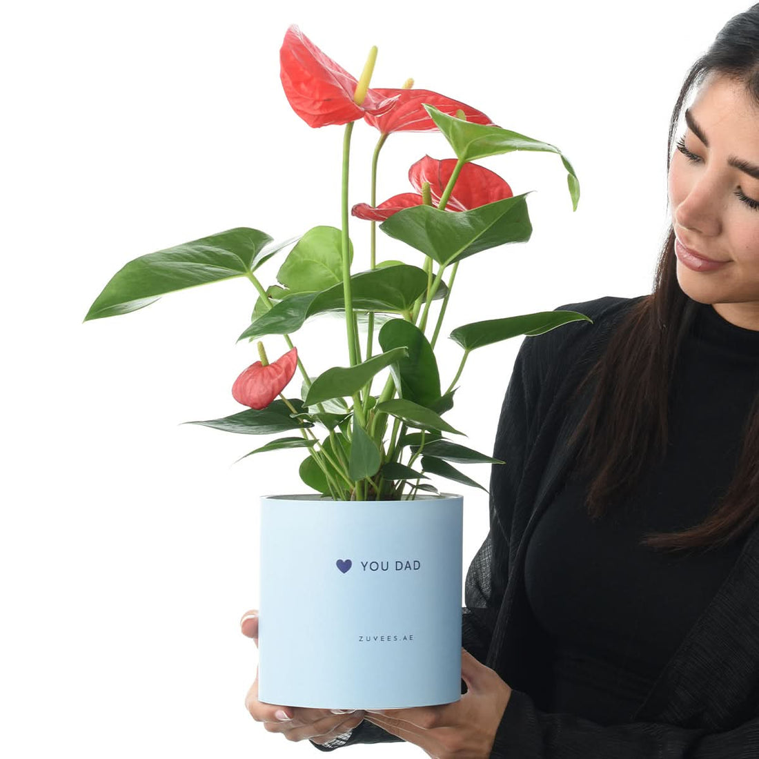 Woman holding a red Anthurium plant in a Love You Dad vase, Father&