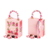 Pink floral gift boxes with silk handles, luxury chocolates displayed.