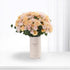Pastel peach roses in minimalist vase with "Thank You" text.