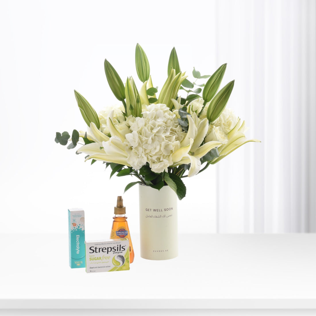 White lily and hydrangea bouquet with "Get Well Soon" vase, Strepsils, electrolyte, and honey.