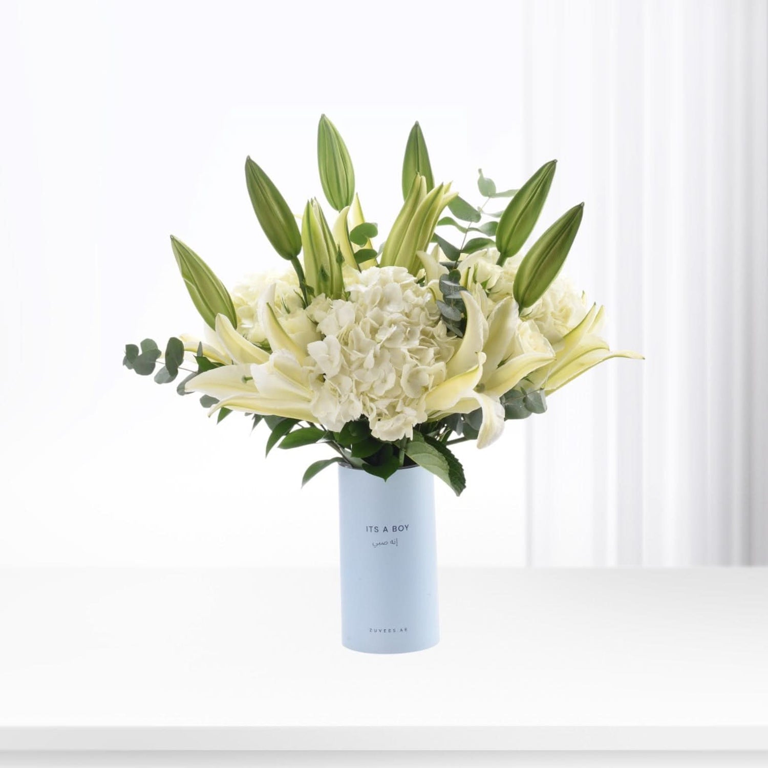 Elegant white lilies and hydrangeas in light blue "It&