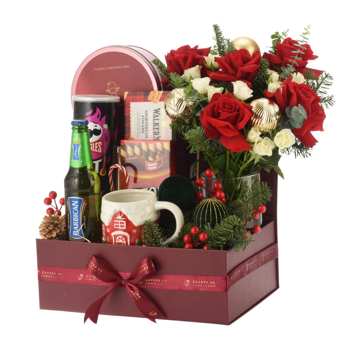 Rich burgundy gift box with red roses, festive treats, and holiday decor.
