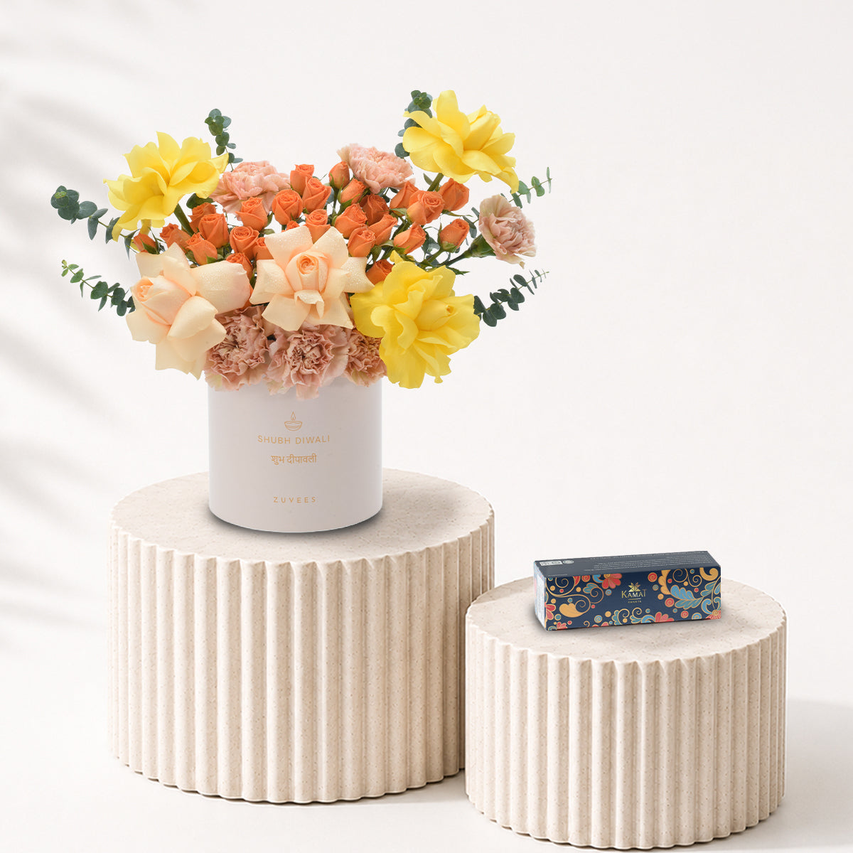 Diwali Yellow Rose &amp; Peach Bloom White Box Sweets Combo