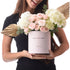 Pink box with "Happy Birthday," roses, hydrangeas, and gold palm leaves.