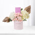 Pink roses, white hydrangeas, gold leaves in blush “Happy Birthday” box with Chanel card.