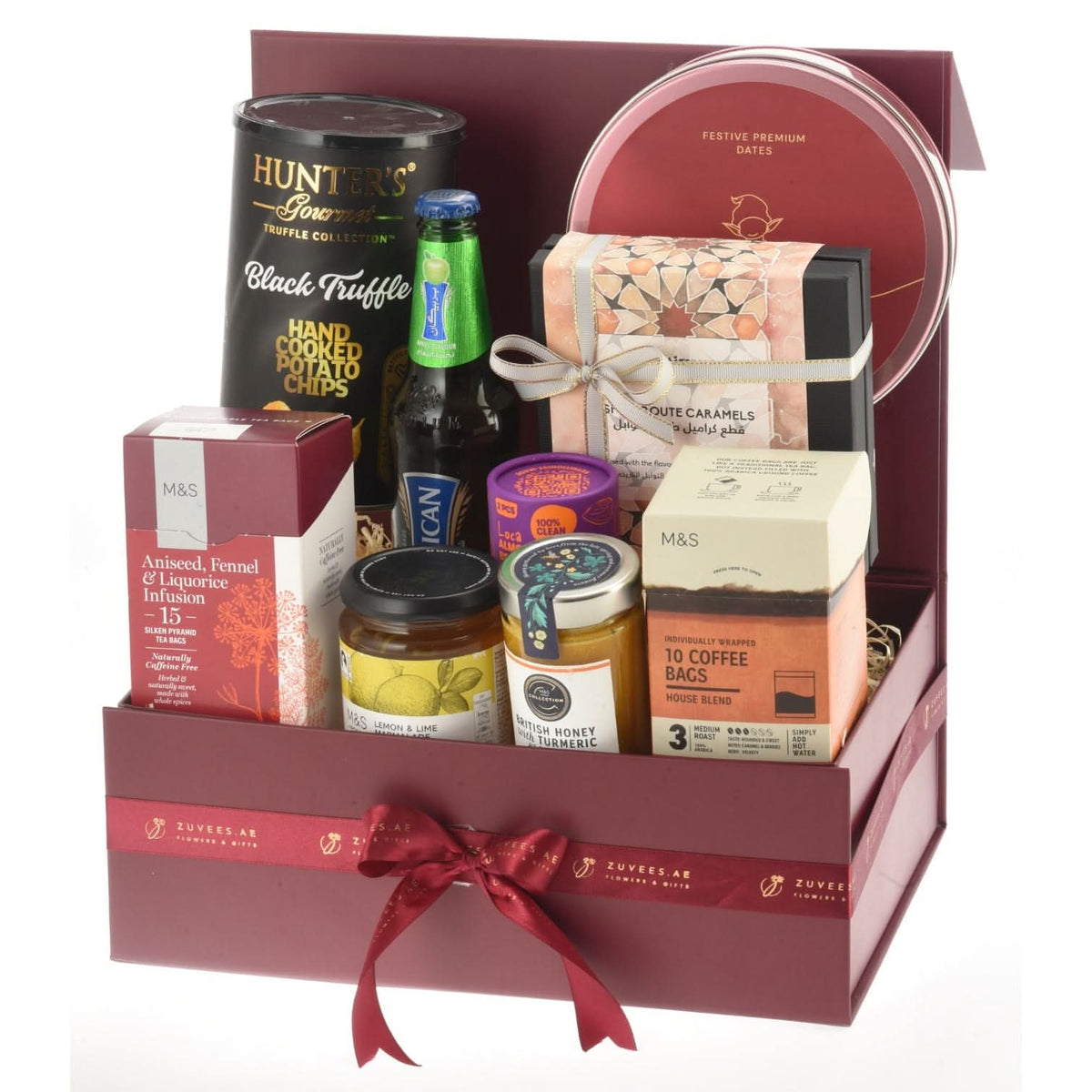 Luxurious burgundy gift box filled with gourmet treats and festive sweets.