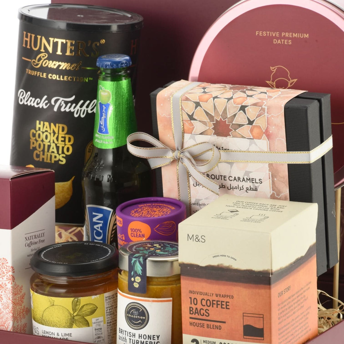 Luxury gourmet gift hamper with truffle chips, coffee, honey, and festive dates.