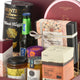 Luxury gourmet gift hamper with truffle chips, coffee, honey, and festive dates.
