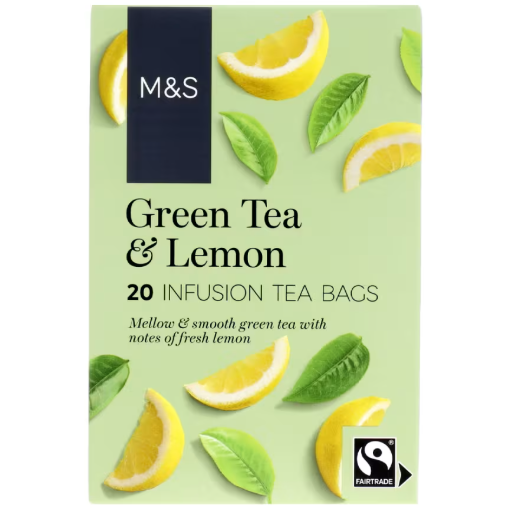 Light green pack with lemon slices and leaves, Fairtrade certified green tea &amp; lemon bags.