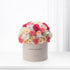 Pink, peach, and white roses and carnations in a beige "Happy Birthday" box.