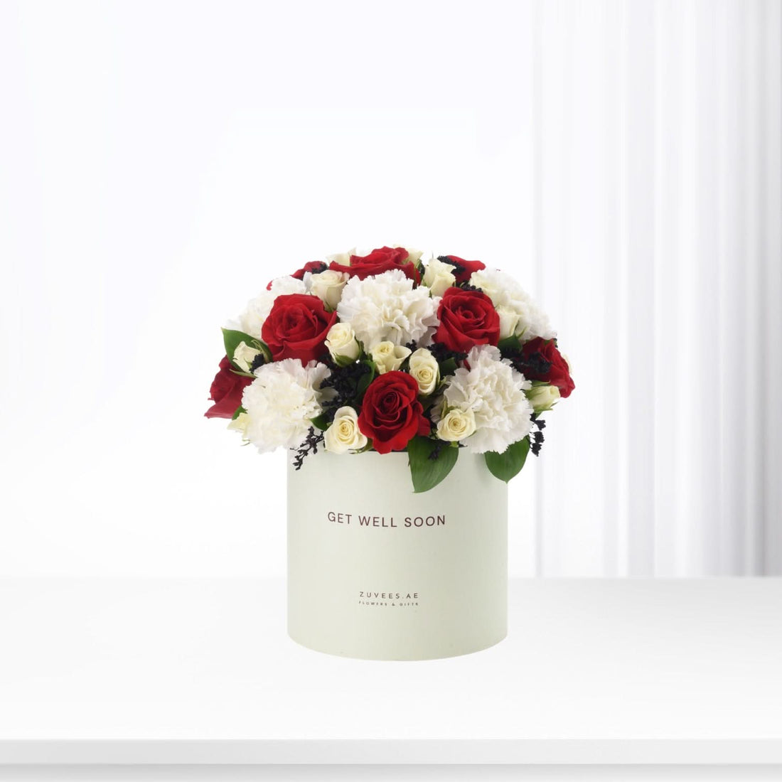 Red and white roses with carnations in "Get Well Soon" box, elegant gift for recovery.