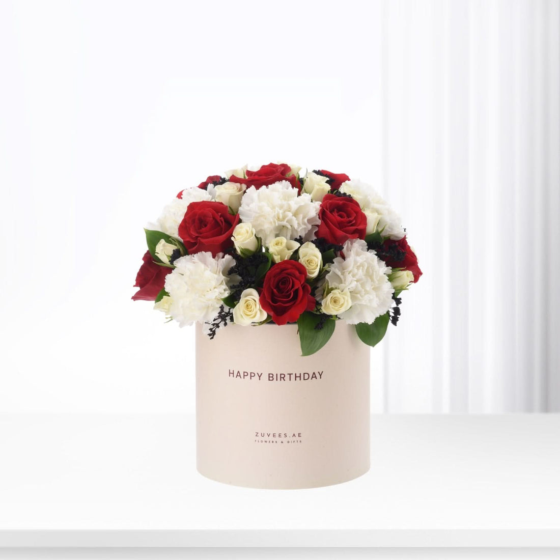 Elegant red and white roses in beige box with "Happy Birthday" text.