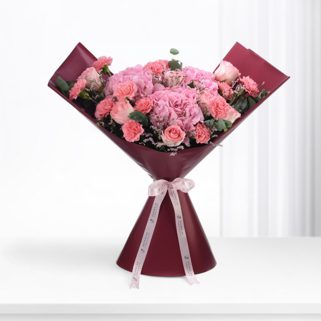 Pink roses, carnations, and baby&