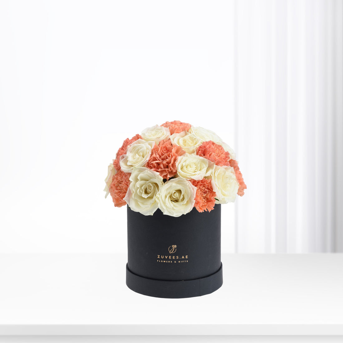 Elegant coral and ivory roses &amp; carnations in matte black box.
