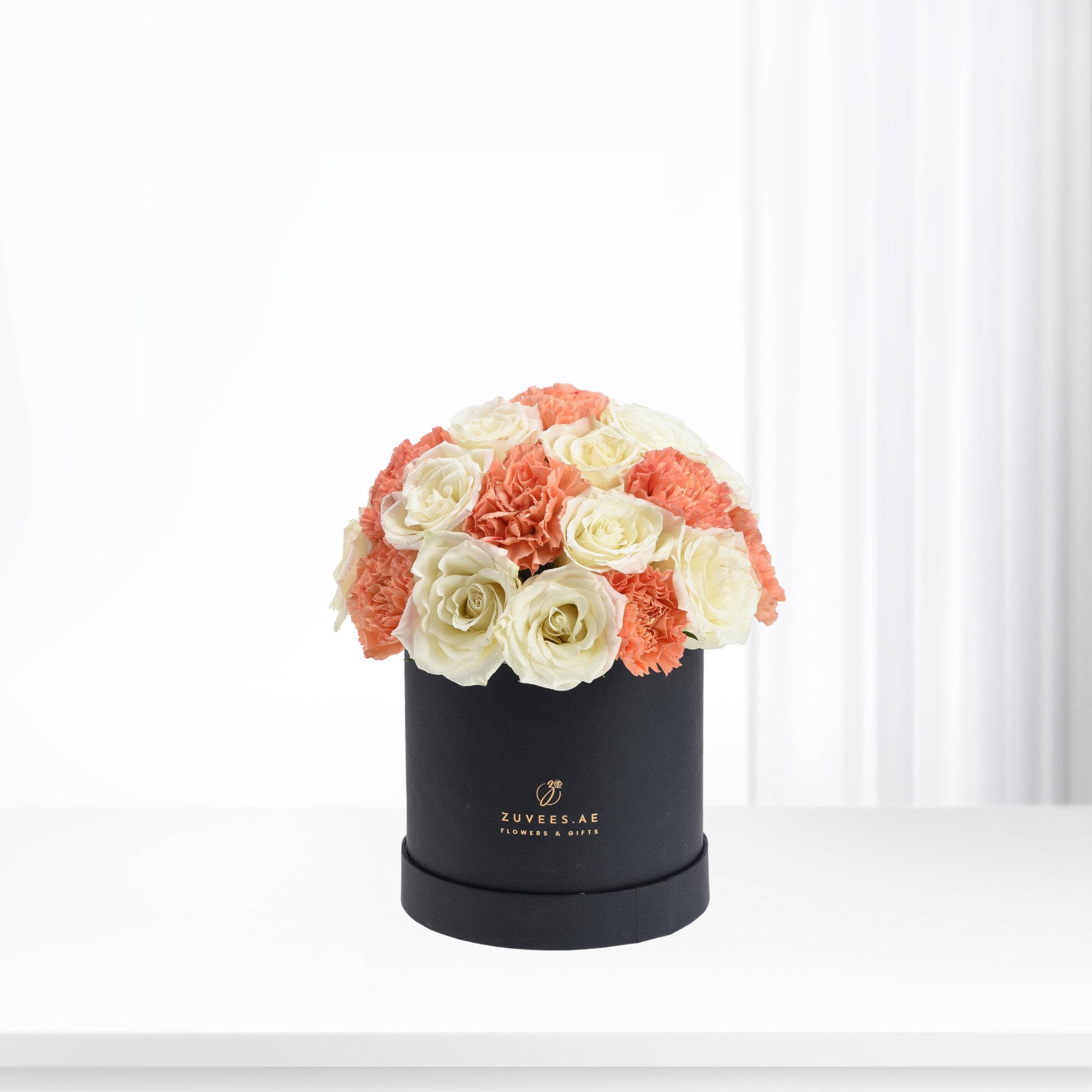 Elegant coral and ivory roses &amp; carnations in matte black box.