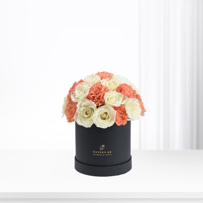 Elegant coral and ivory roses &amp; carnations in matte black box.