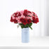 Vibrant red and pink roses in light blue "It&