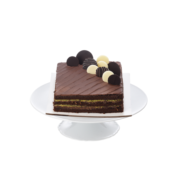 Rich chocolate cake slice, layered, topped with assorted truffles, elegant white pedestal.