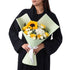 Sunflower, yellow & white roses in mint wrap, elegant white bow.