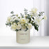Elegant white rose and carnation bouquet in "Thank You" branded cream cylinder.