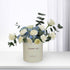 Elegant white roses and blue hydrangeas in minimalist cream "Thank You" gift box.
