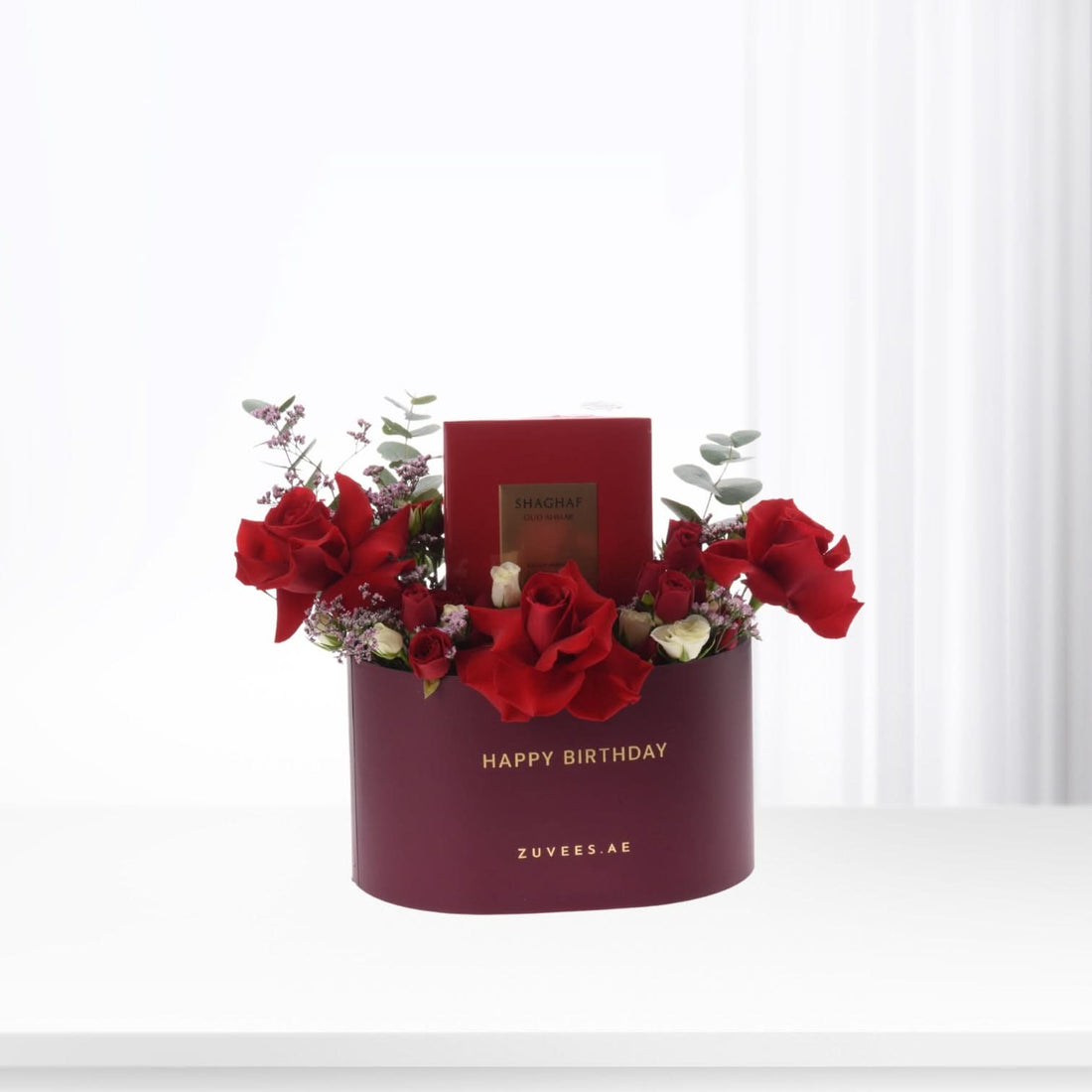 Rich burgundy hat box with red roses, eucalyptus, and "Happy Birthday" gold text.