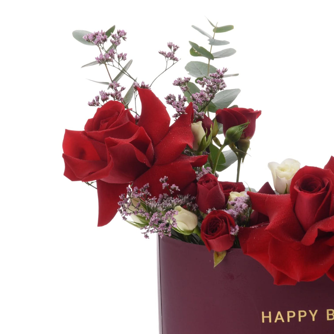 Vibrant red roses, white blooms, and purple filler in a burgundy "Happy Birthday" gift bag.