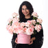 Pink roses overflow from a matching box reading "YOU INSPIRE!"